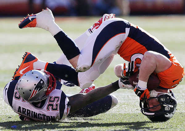 Wes Welker (right) knocked Aqib Talib (not pictured) from the game on an off-field pick Sunday.
